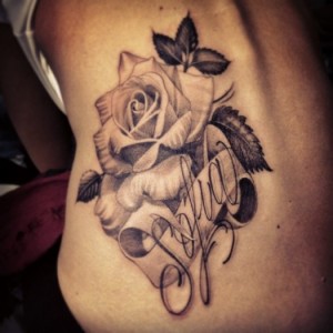 Beautiful Black Rose Tattoo with Leaves