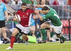 Team Canada wing James Pritchard, left, breaks a tackle against Team Ireland wing Fergus McFadden, right, during first half of an international friendly rugby match in Toronto on Saturday, June 15, 2013. THE CANADIAN PRESS/Nathan Denette