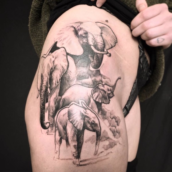 elephants tattoo on the thigh